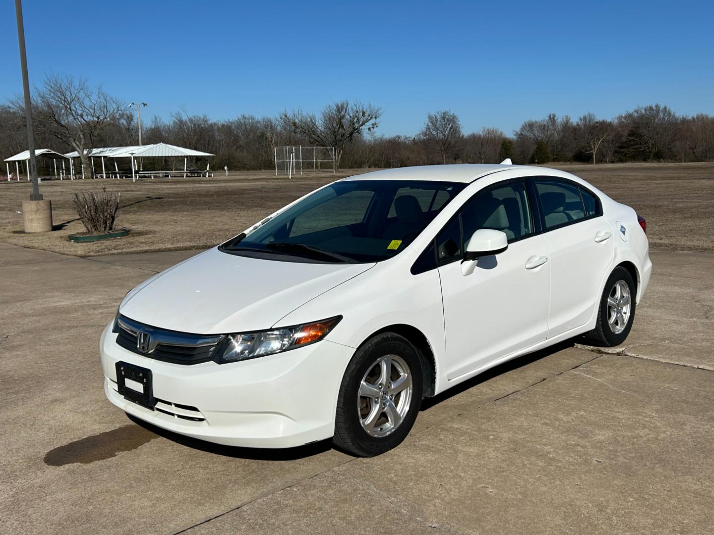 2012 White /Gray Honda Civic CNG Sedan 5-Speed AT (19XFB5F53CE) with an 1.8L L4 SOHC 16V CNG engine, 5-Speed Automatic transmission, located at 17760 Hwy 62, Morris, OK, 74445, (918) 733-4887, 35.609104, -95.877060 - 2012 HONDA CIVIC 1.8L FWD DEDICATED CNG (COMPRESSED NATURAL GAS) VEHICLE. FEATURES REMOTE KEYLESS ENTRY, POWER LOCKS, POWER WINDOWS, POWER MIRRORS, MANUEL SEATS, AM/FM RADIO, CD PLAYER, USB, AUX, BLUETOOTH FOR HANDS-FREE CALLING, 12V POWER OUTLET, CRUISE CONTROL, TRACTION CONTROL, AND CLOTH SEATS. 1 - Photo#0